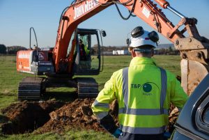 Engineer in front of an excavator