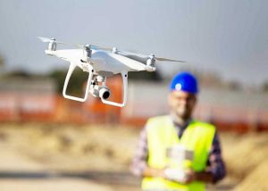 Engineer flying a drone