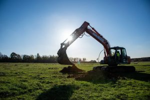 Excavator removing dirt